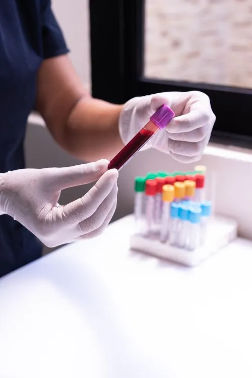 Student practicing a blood draw during hands-on phlebotomy class