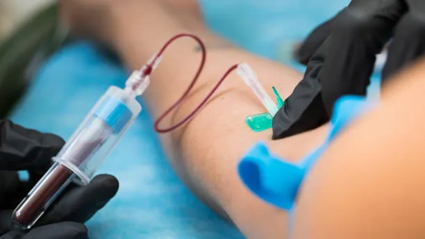 A certified wellness professional checking vitals during a mobile visit